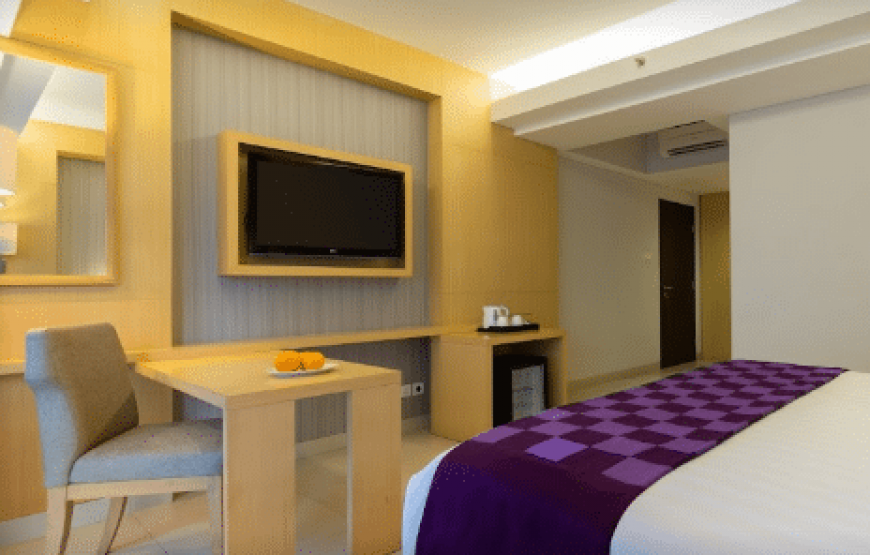 Quest Hotel Kuta Deluxe Room with Pool View